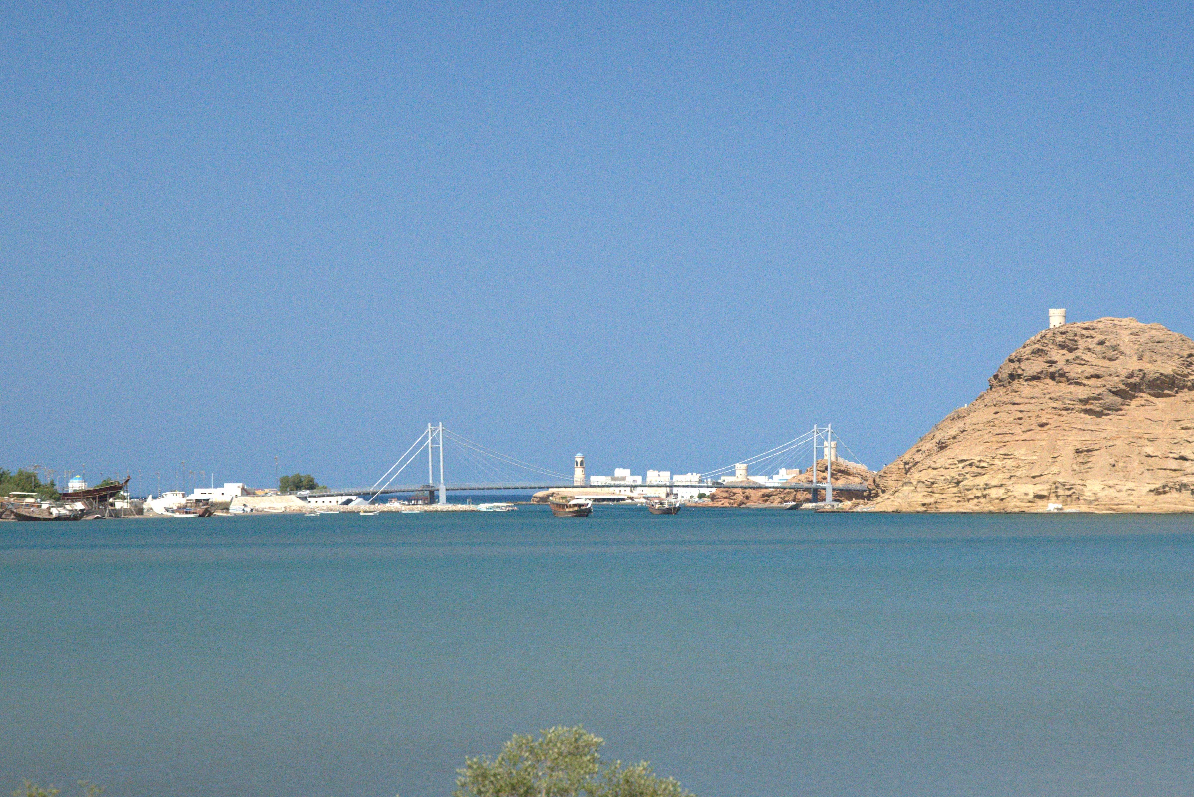Sur lagoon with the Khor Al Batah bridge and the Al Ayjah watchtower